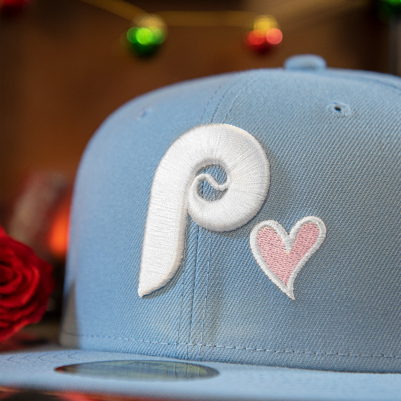 phillies and heart logo on the Philadelphia Phillies Heart Patch 1980 World Series Pink Bottom Brim Icy Blue Fitted Cap | Phillies Side Patch 59Fifty Fitted Cap