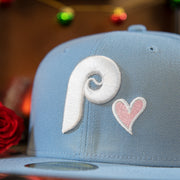 phillies and heart logo on the Philadelphia Phillies Heart Patch 1980 World Series Pink Bottom Brim Icy Blue Fitted Cap | Phillies Side Patch 59Fifty Fitted Cap