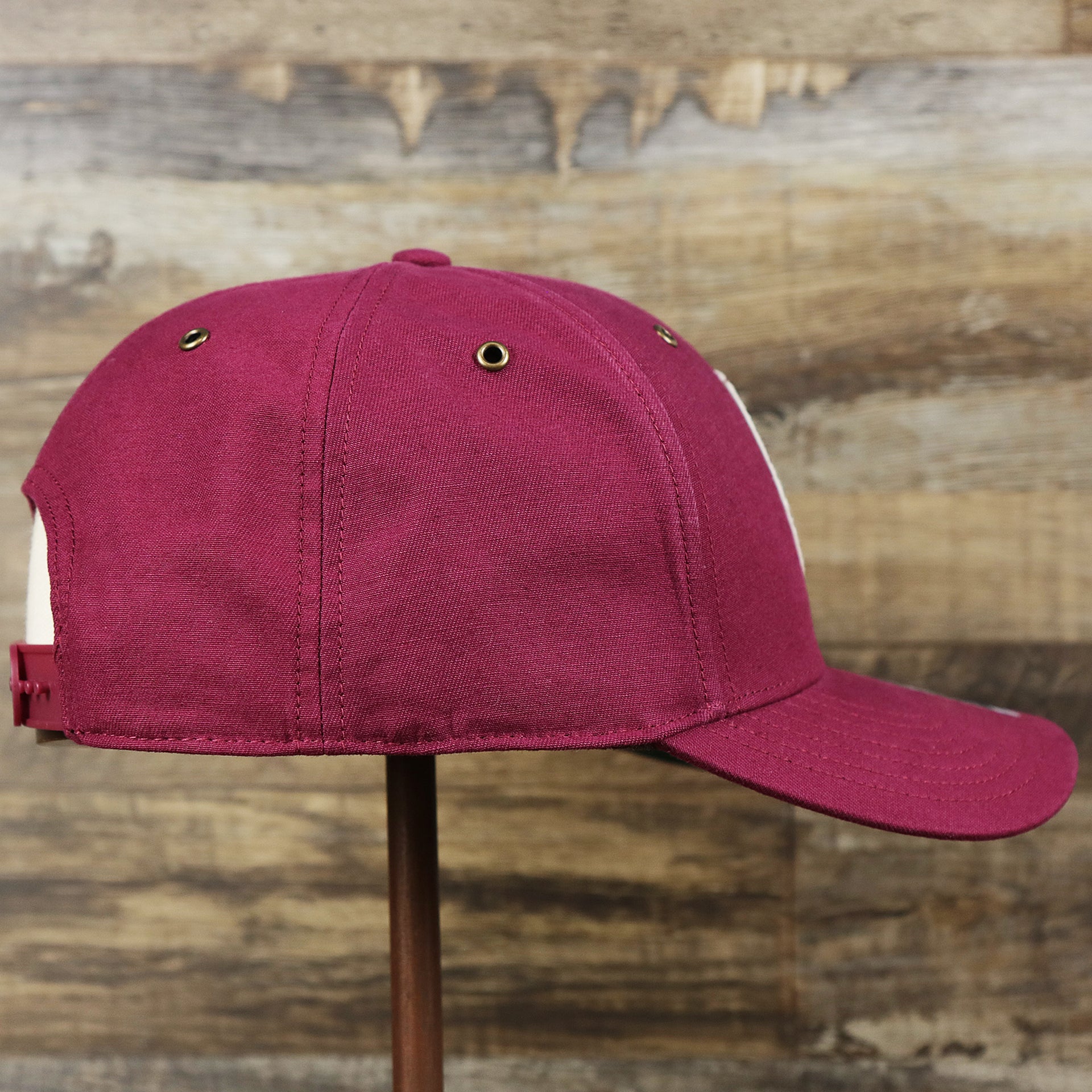 The wearer's right on the Cooperstown Philadelphia Phillies Felt Phillies Logo Snapback Hat | Cardinal Snapback Cap