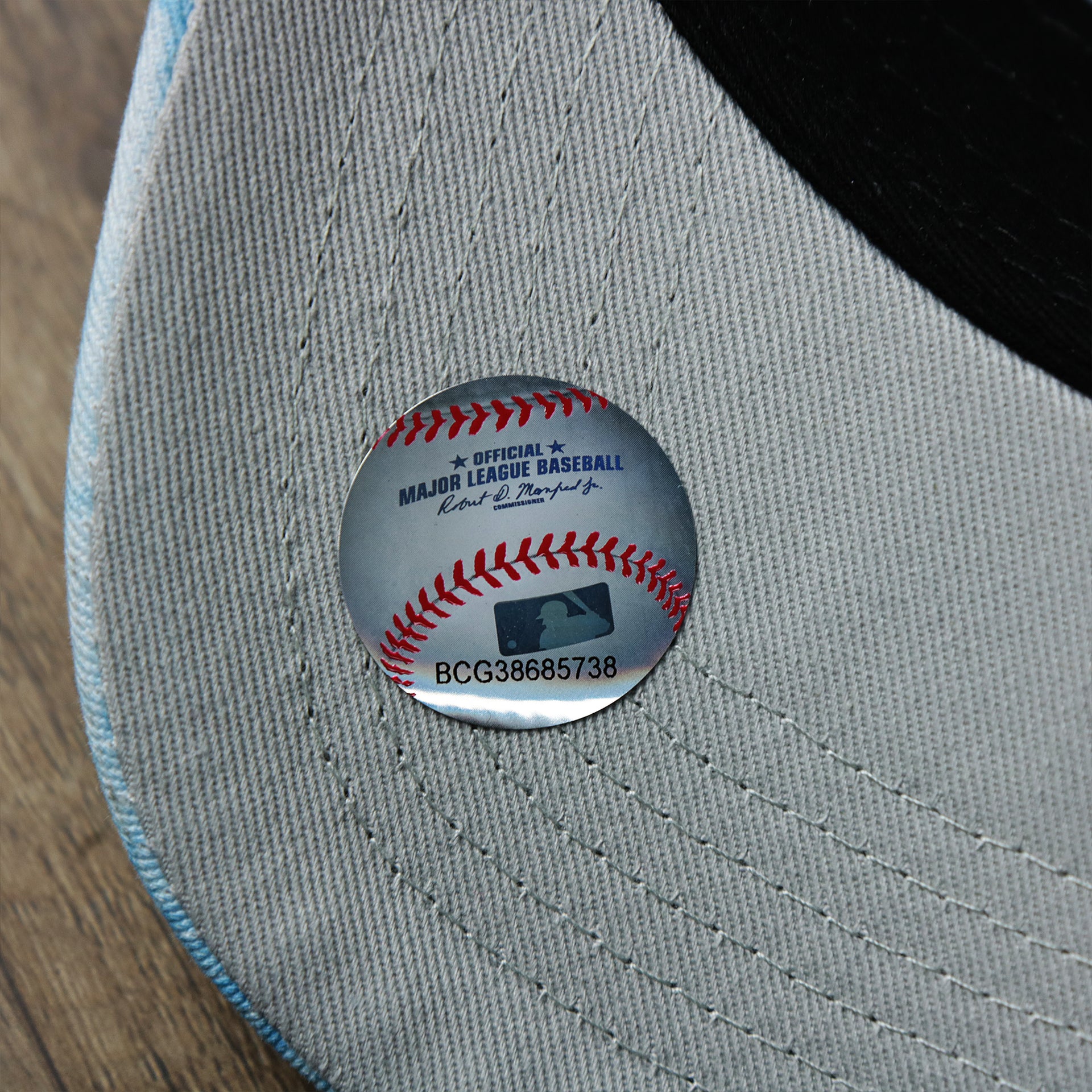 The MLB Baseball Sticker on the Women’s Philadelphia Phillies Tie Dye Print Gray Bottom Mesh Trucker Hat | White Mesh Snapback