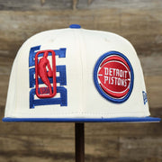The front of the Detroit Pistons NBA 2022 Draft Gray Bottom 9Fifty Snapback | New Era Cream/Royal Blue