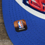 The NBA Offical Headwear Sticker on the Detroit Pistons NBA 2022 Draft Gray Bottom 9Fifty Snapback | New Era Cream/Royal Blue