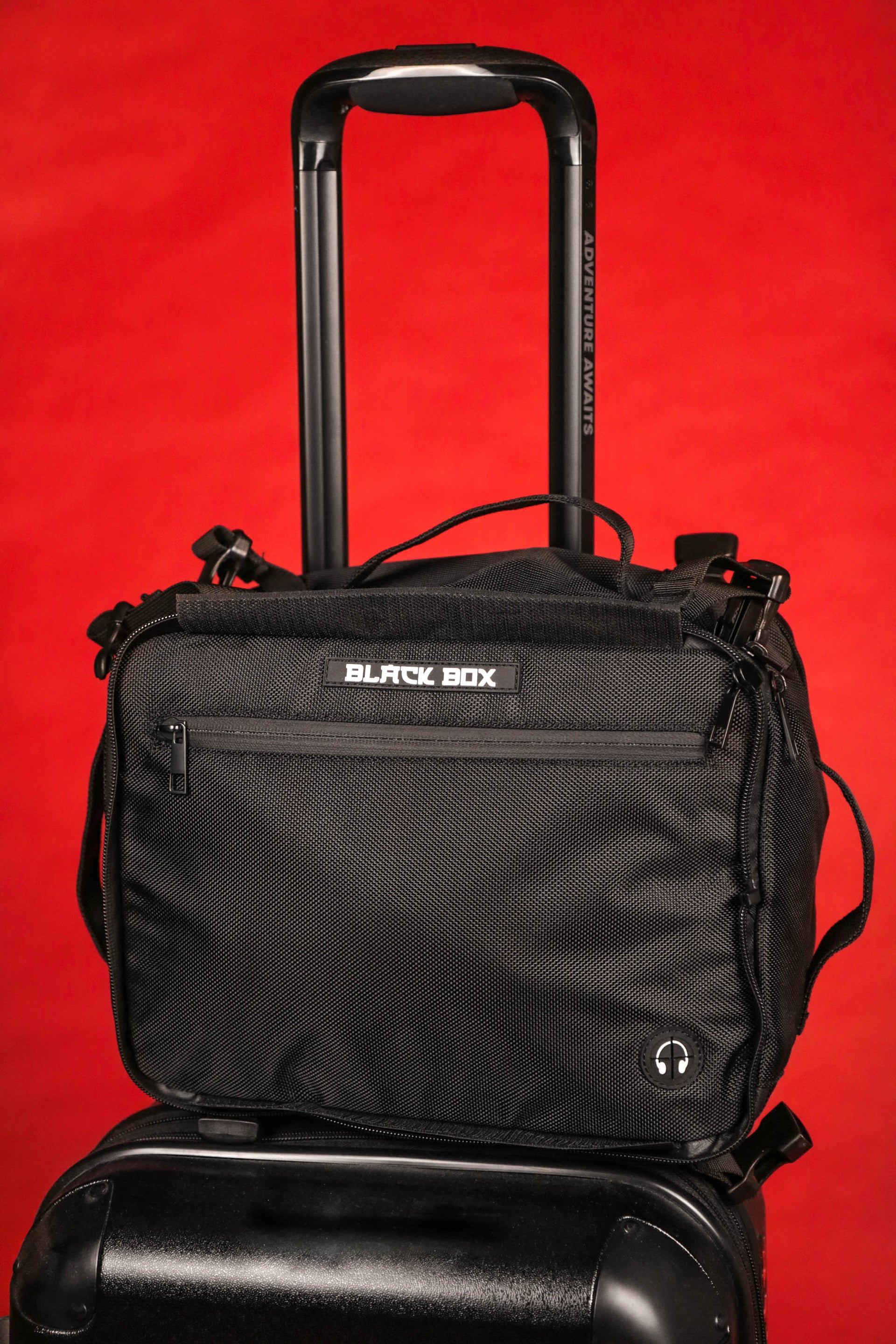 The Black Box Media Camera Travel Bag / Cap Carrier with Custom Dividers and Glasses Case on a suit case