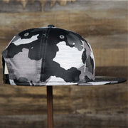 The Wearer's Right on the Los Angeles Raiders NFL OnField Summer Training 2022 Camo 9Fifty Snapback | Black Camo 9Fifty