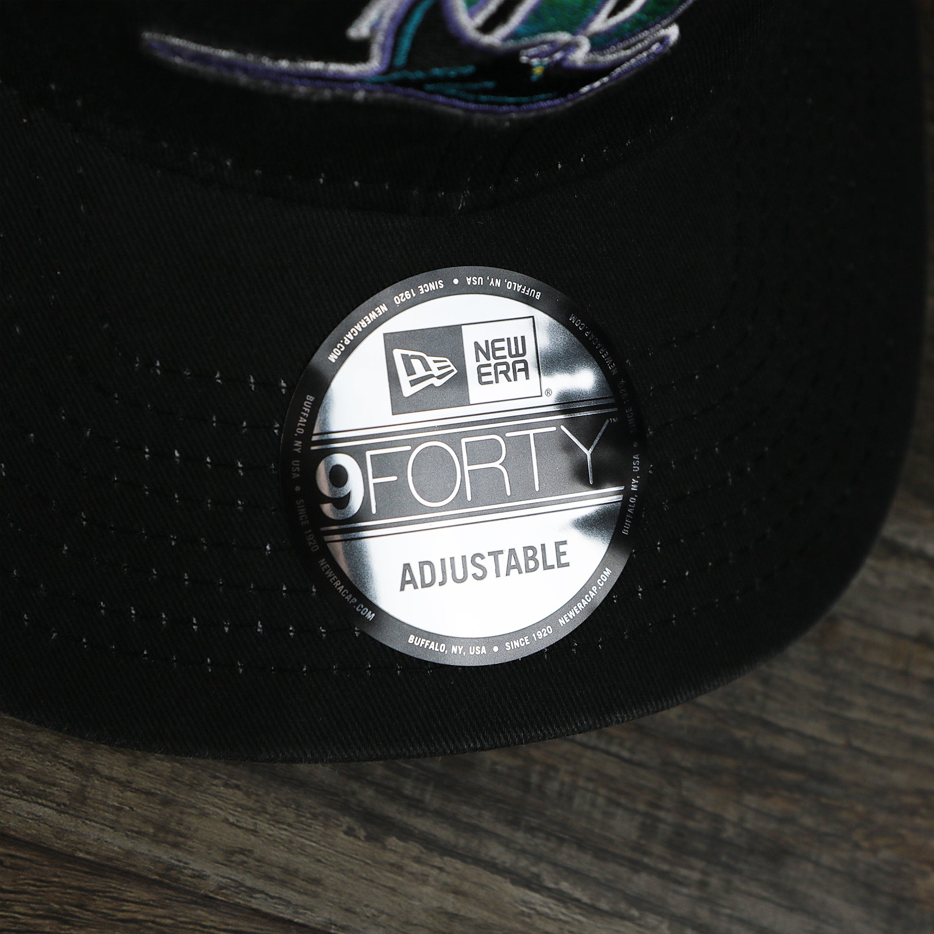 The 9Forty Sticker on the Cooperstown Tampa Bay Rays 1998s Logo Worn Colorway Mesh Back 9Forty Dad Hat | Black 9Forty Hat