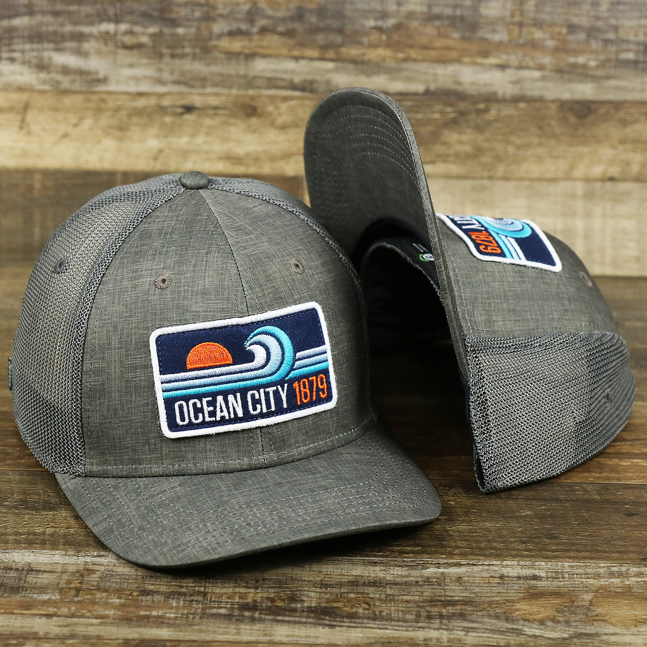 The OCNJ Ocean City 1879 Sunset Wave Logo Mesh Stretch FIt Hat | Dark Green And Dark Grey Stretch Fit Hat