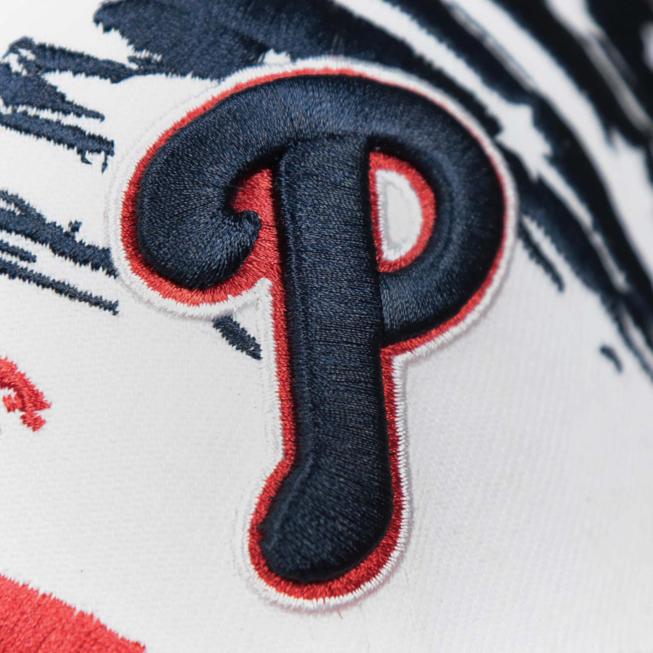The Phillies logo on the Philadelphia Phillies 2022 4th of July Stars And Stripes 39Thirty | New Era Navy OSFM