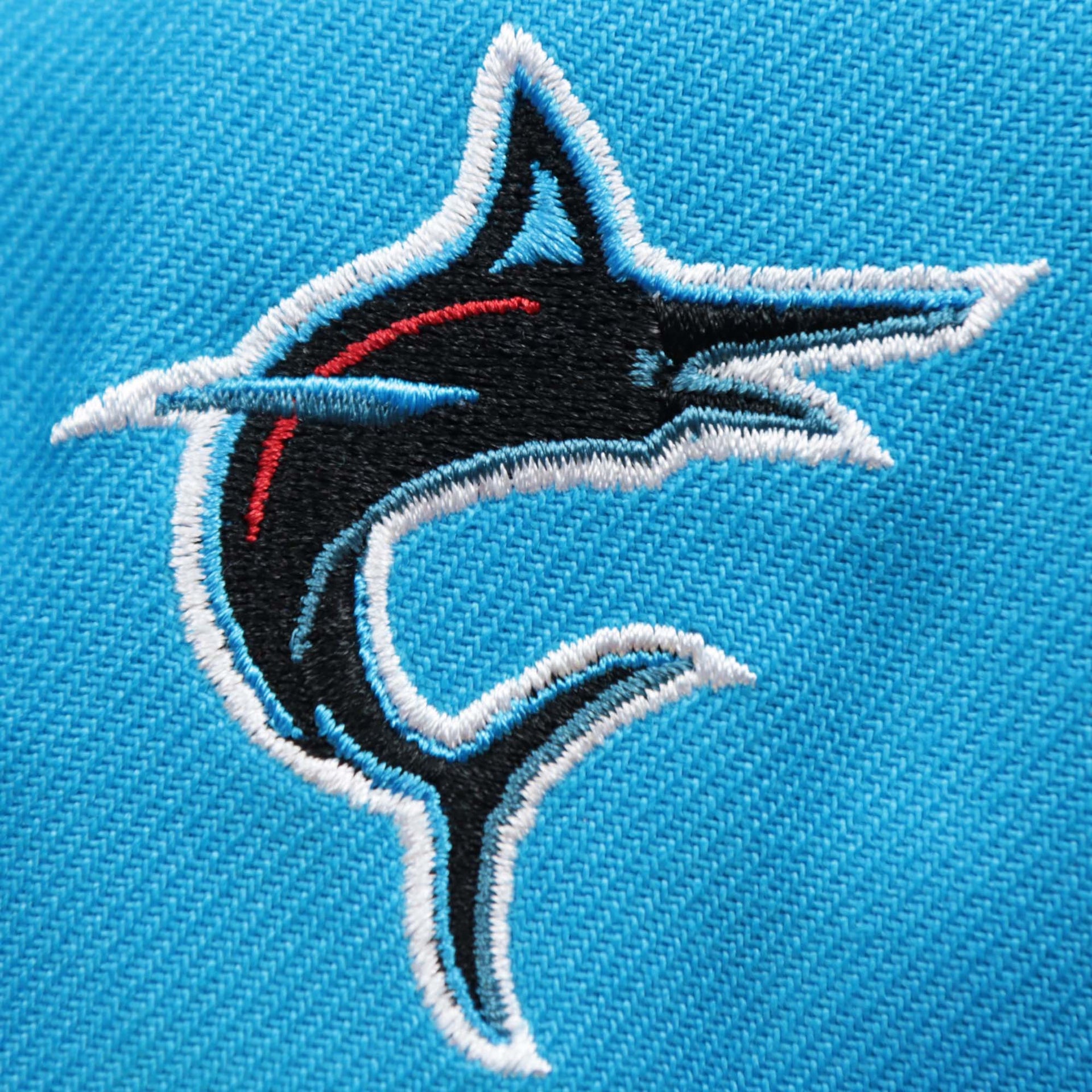 The Miami Dolphins Side Patch on the Miami Marlins MLB City Connect 2021 On-Field Side Patch 59Fifty Fitted | Blue
