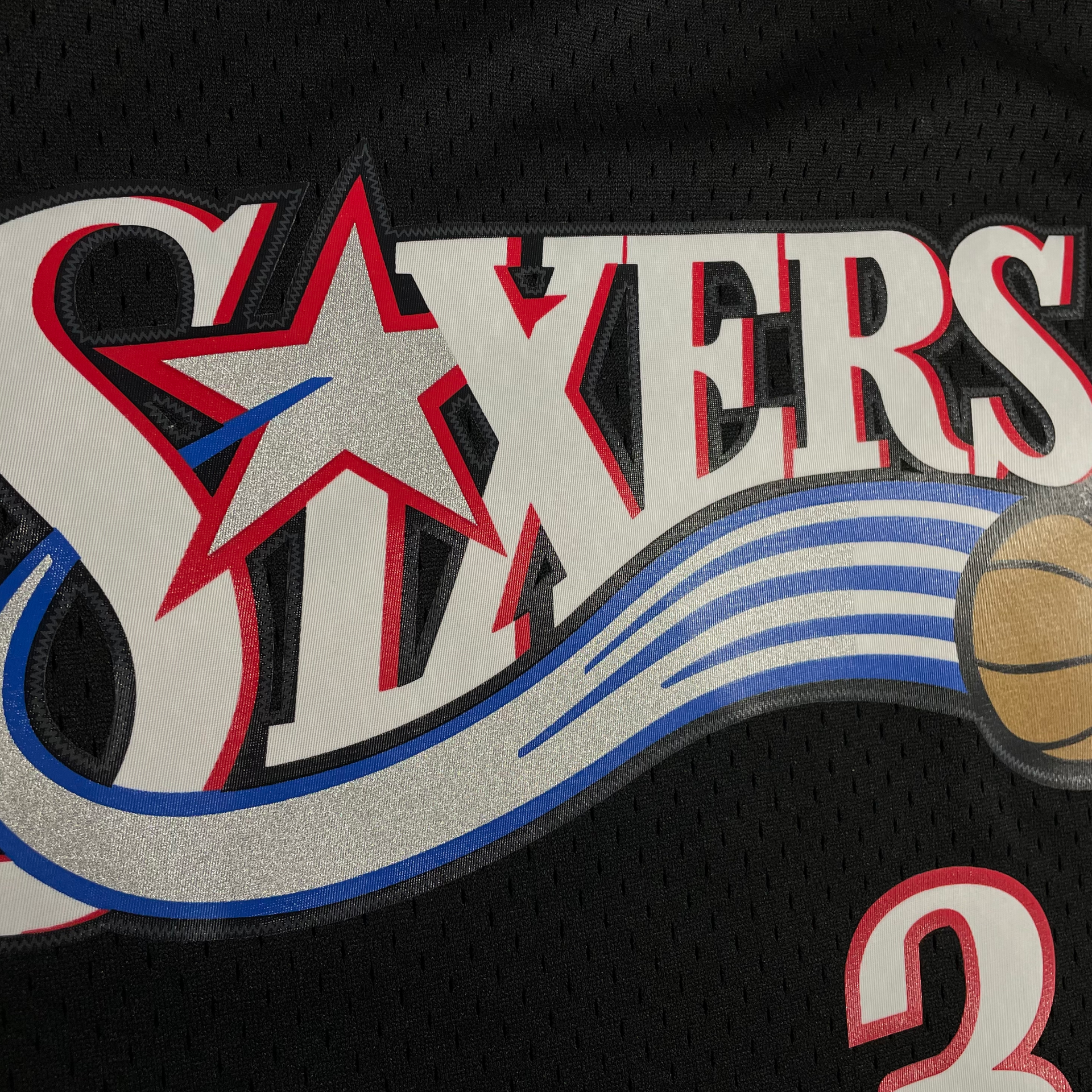 Close up of the front logo on the Allen Iverson 2000-2001 Philadelphia 76ers NBA Playoffs Throwback SwingMan Jersey | Black, Mitchell and Ness