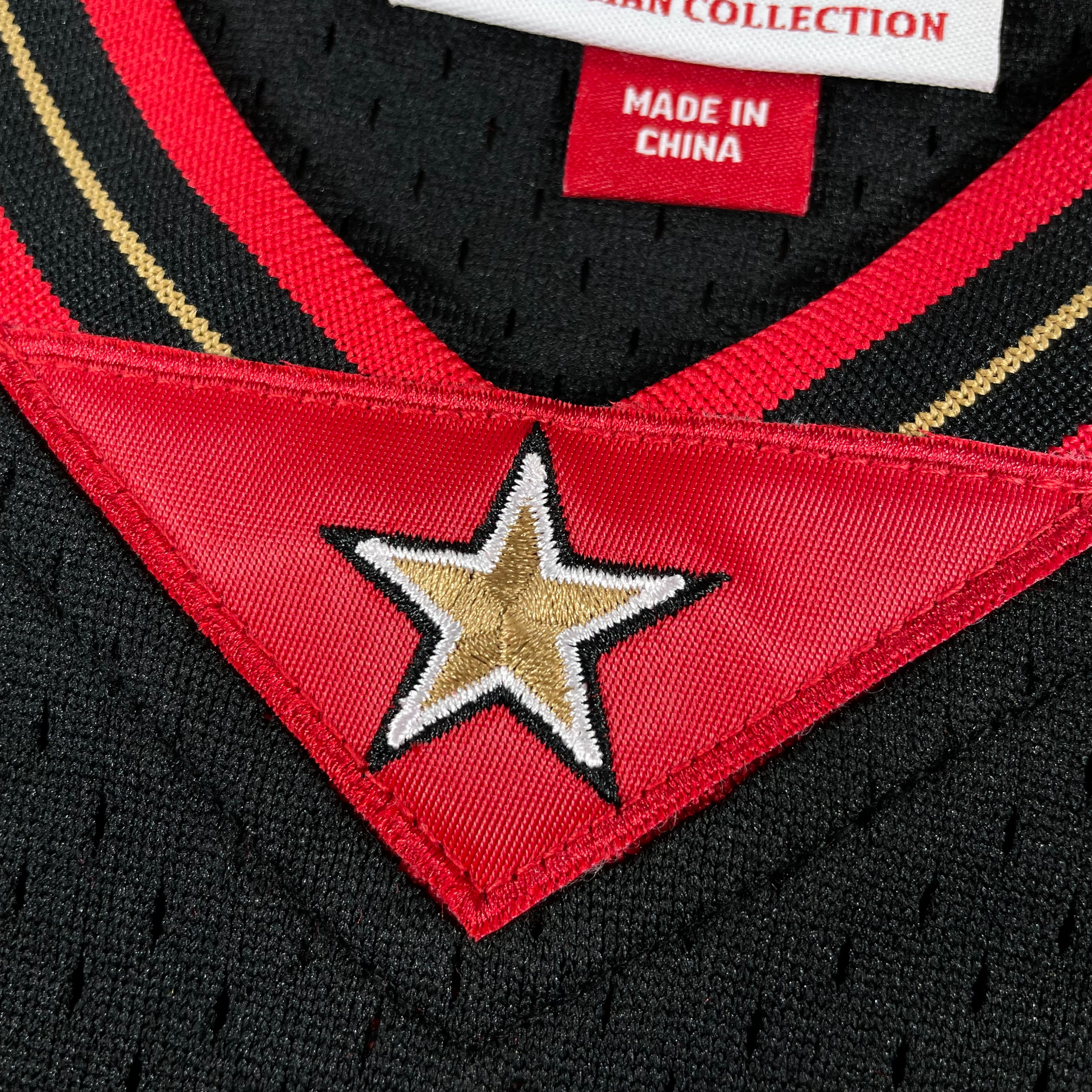 Close up of the embroidered star on the Allen Iverson 2000-2001 Philadelphia 76ers NBA Playoffs Throwback SwingMan Jersey | Black, Mitchell and Ness