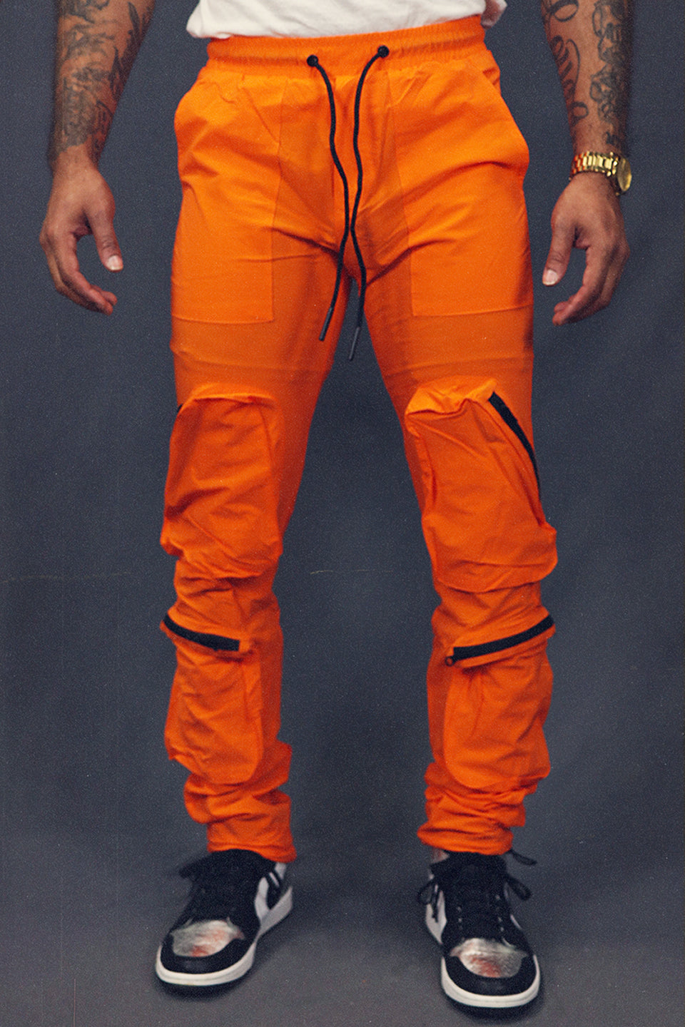 Men's Tactical Nylon Track Pants Street Sweatpants Utility Joggers with Zipper Pockets | Orange front view