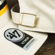 The 47 Brand Sticker on the Throwback Pittsburgh Steelers Striped Wordmark Legacy Steelers Side Patch Crossroad Dad Hat | Bone Dad Hat