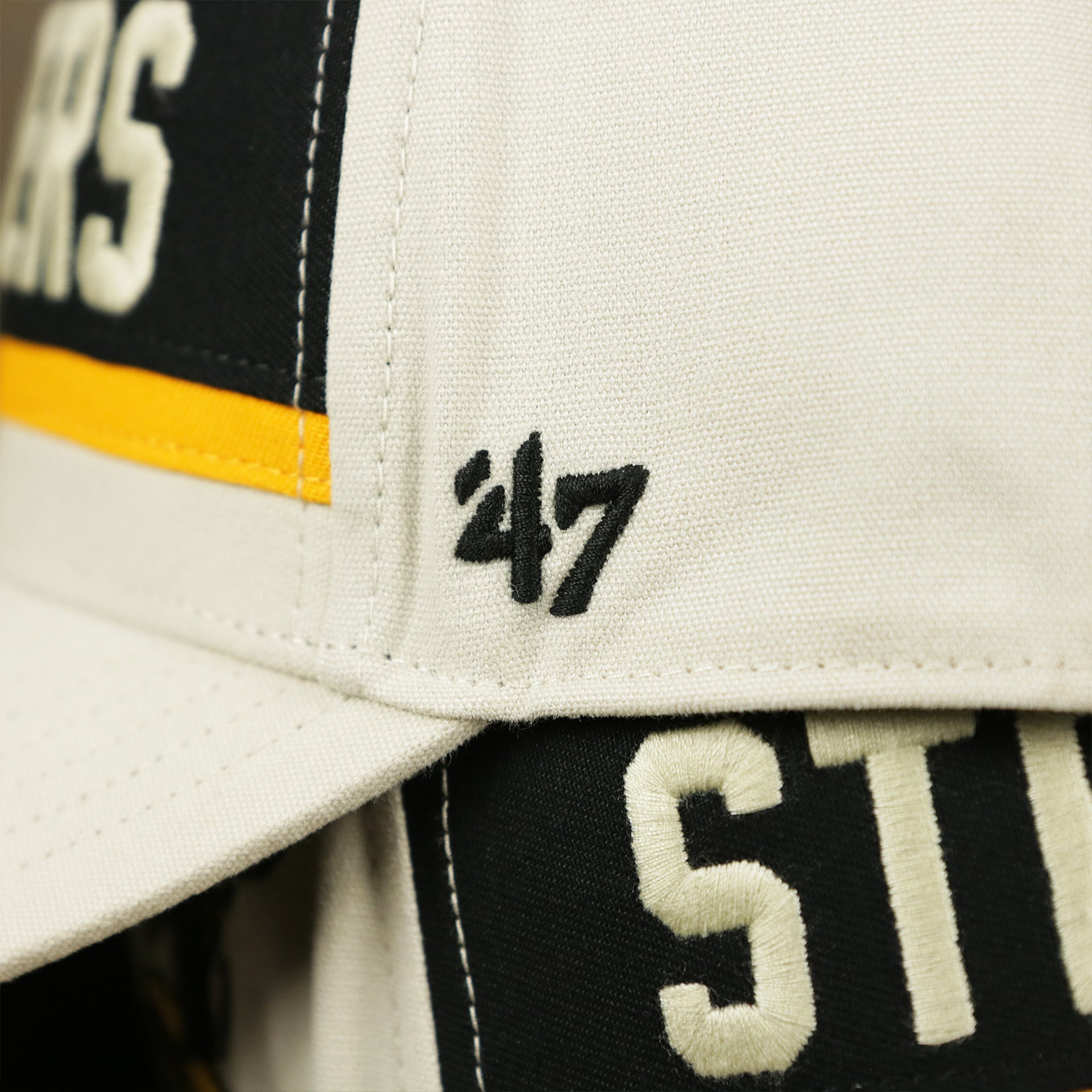 The 47 Brand Logo on the Throwback Pittsburgh Steelers Striped Wordmark Legacy Steelers Side Patch Crossroad Dad Hat | Bone Dad Hat