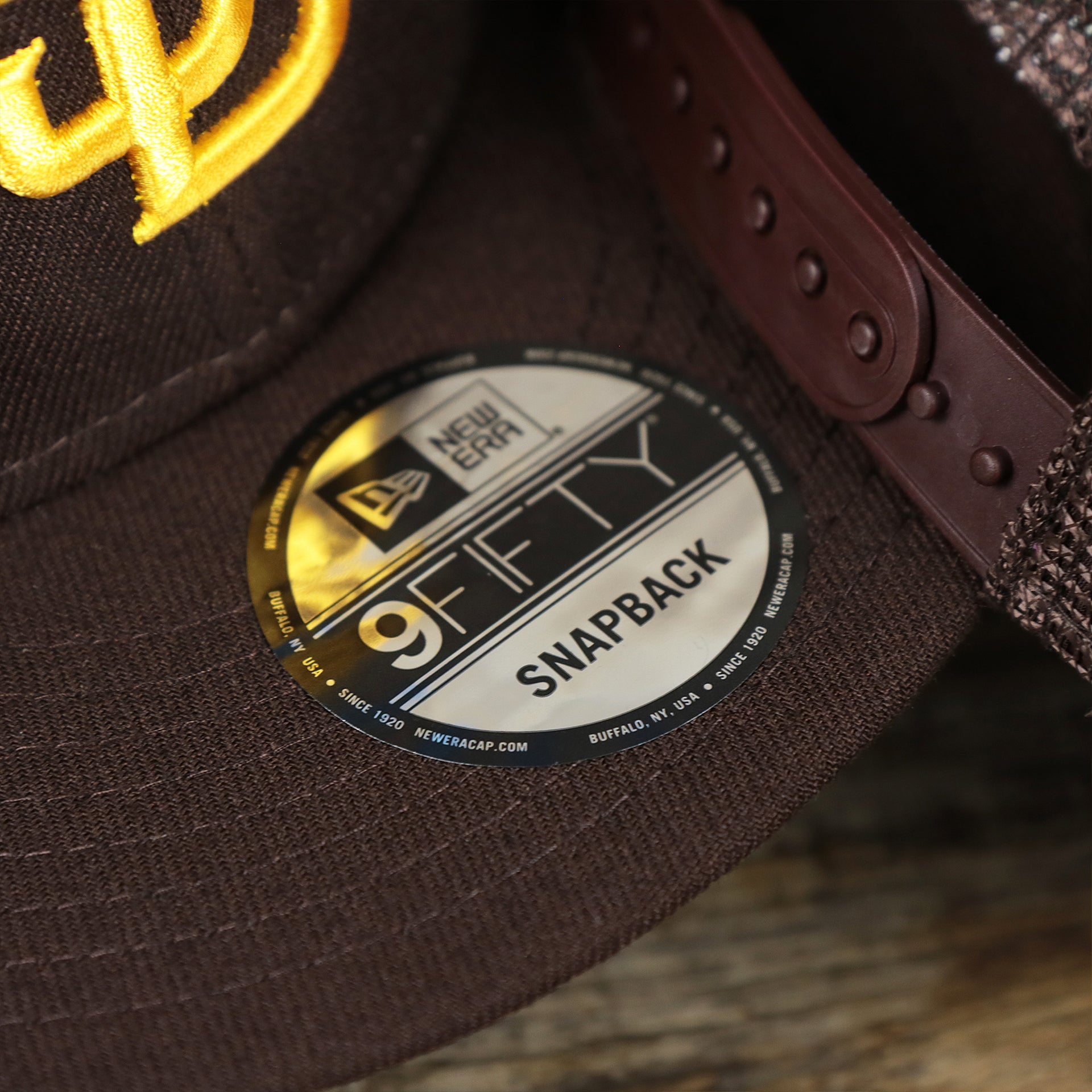 The 9Fifty Sticker on the San Diego Padres Metallic All Star Game MLB 2022 Side Patch 9Fifty Mesh Snapback | ASG 2022 Brown Trucker Hat