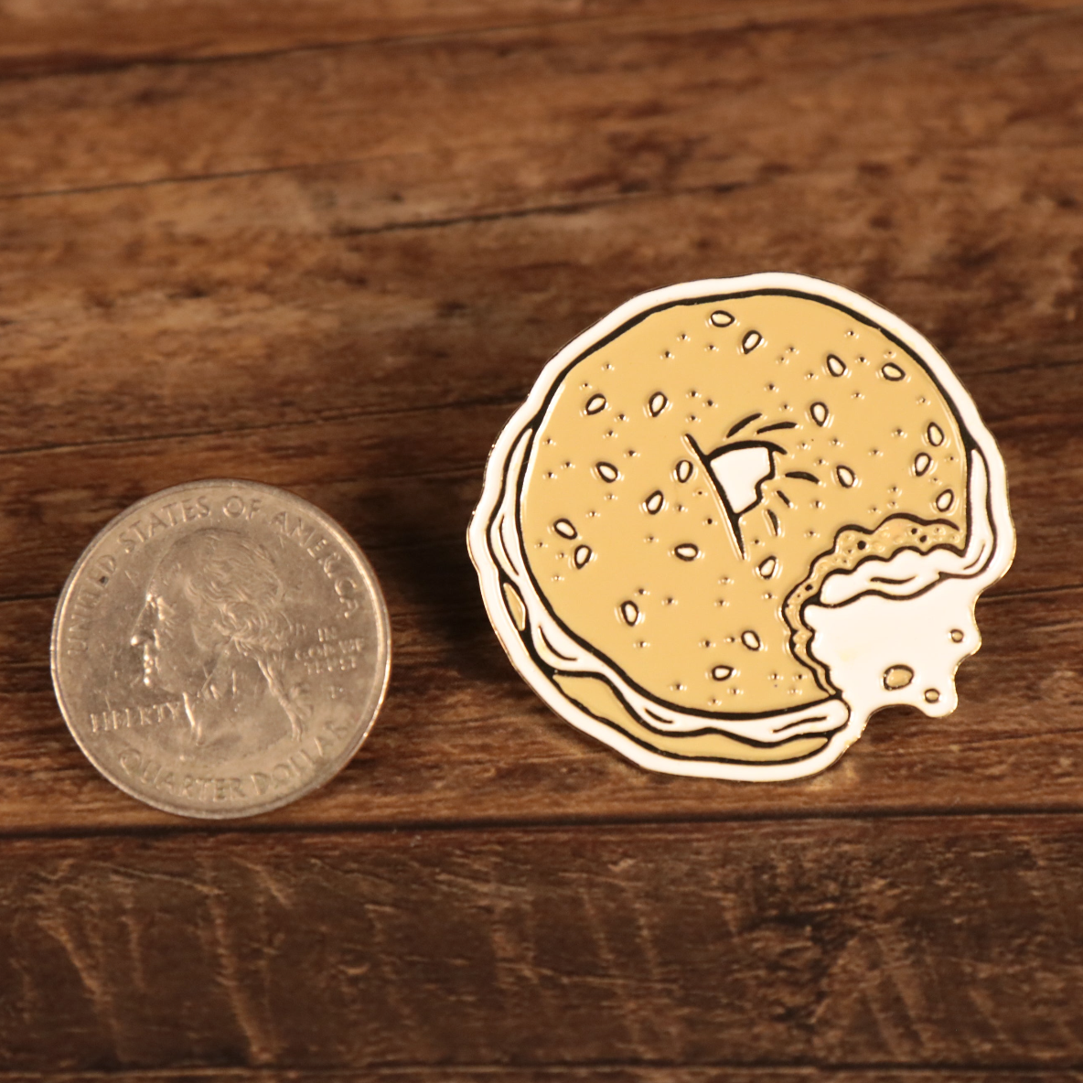 The New York Bagel Fitted Cap Pin | Enamel Pin For Hat compared to a quarter