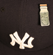 The New York Nut Cracker Drink Fitted Cap Pin | Enamel Pin For Hat on a fitted 