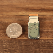 The New York Nut Cracker Drink Fitted Cap Pin | Enamel Pin For Hat compared to a quarter