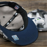 The undervisor on the Seattle Seahawks NFL OnField Summer Training 2022 Camo 9Fifty Snapback | Navy Blue Camo 9Fifty