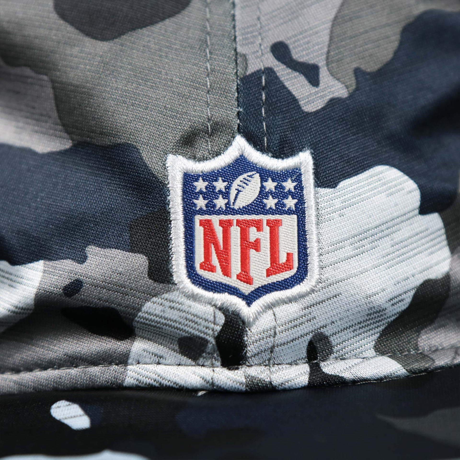 The NFL Logo on the Seattle Seahawks NFL Summer Training Camp 2022 Camo Bucket Hat | Navy Bucket Hat