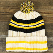 The backside of the Throwback Pittsburgh Steelers Legacy 1962 Steelers Patch Pom Pom Beanie | Natural Beanie