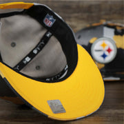 The undervisor on the Pittsburgh Steelers NFL OnField Summer Training 2022 Camo 9Fifty Snapback | Yellow Camo 9Fifty