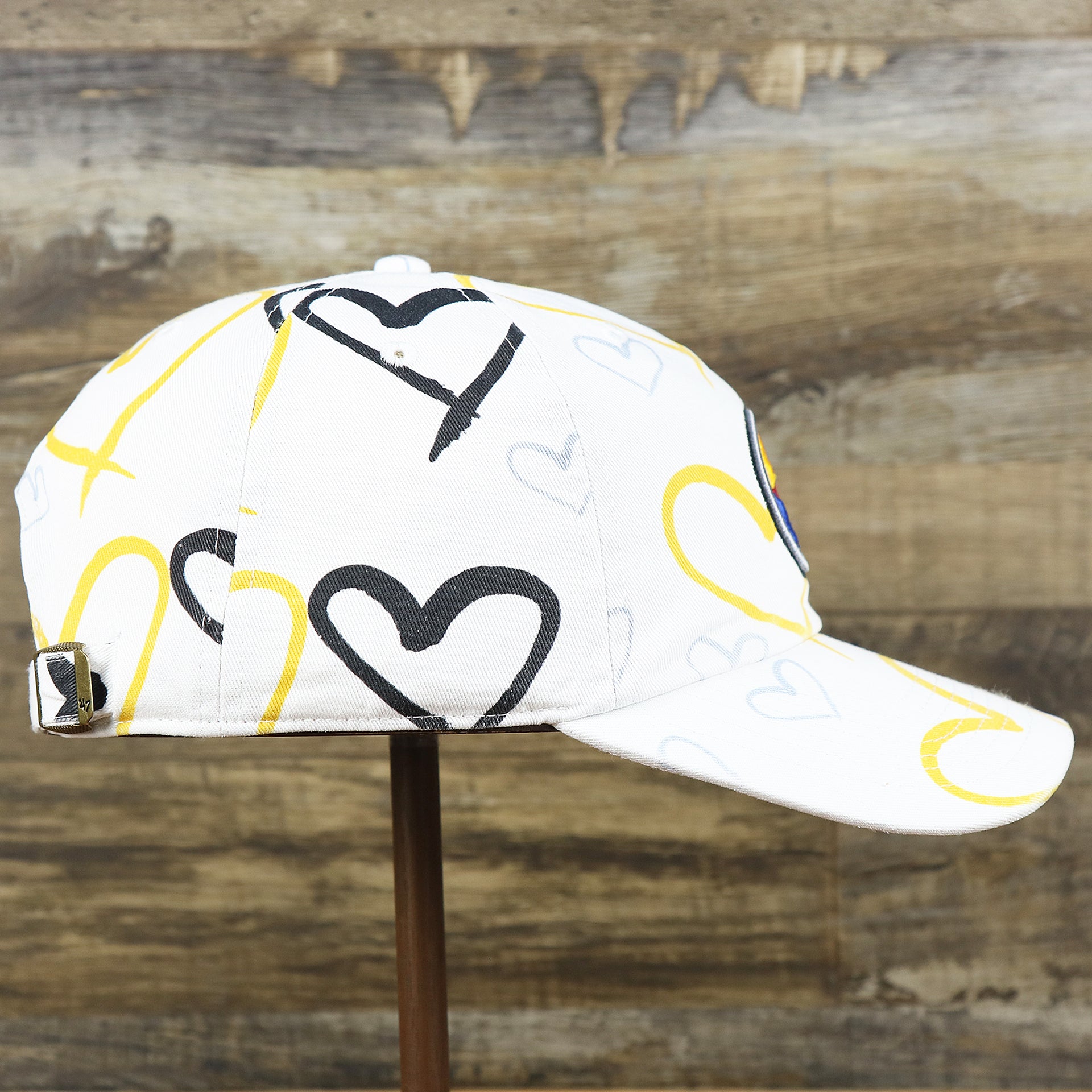 The wearer's right on the Kids Pittsburgh Steelers Hearts All Over Print Dad Hat | White Kid’s Dad Hat