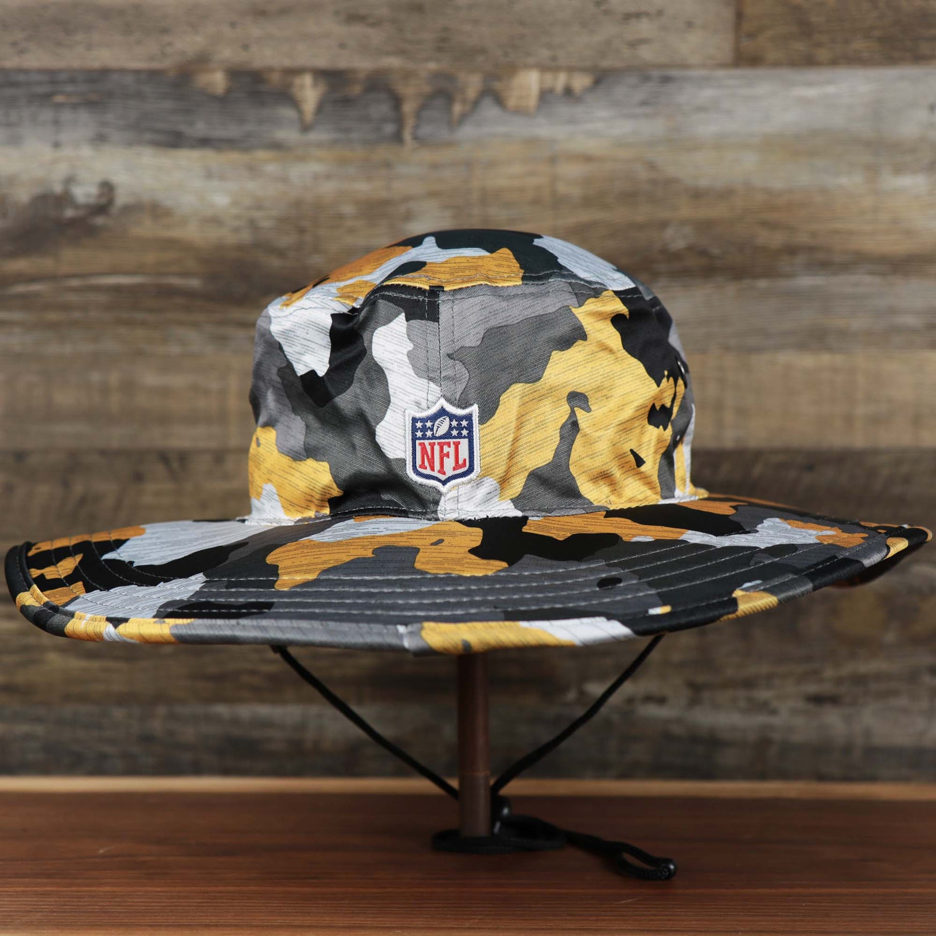 The backside of the Pittsburgh Steelers NFL Summer Training Camp 2022 Camo Bucket Hat | Yellow Bucket Hat