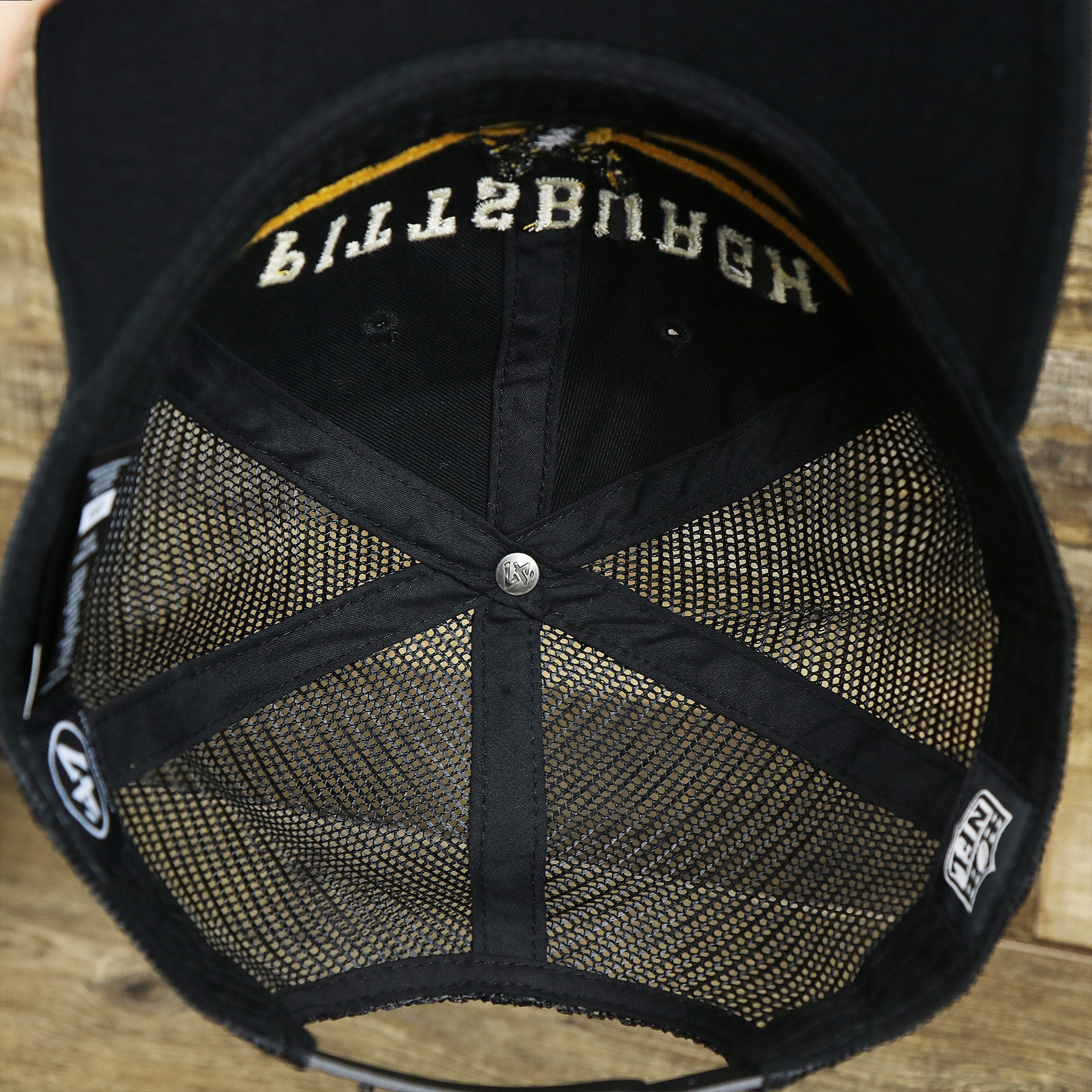 The inside of the Throwback Pittsburgh Steelers Legacy Logo Highpoint Mesh Back Dad Hat | Mesh Back Black Dad Hat