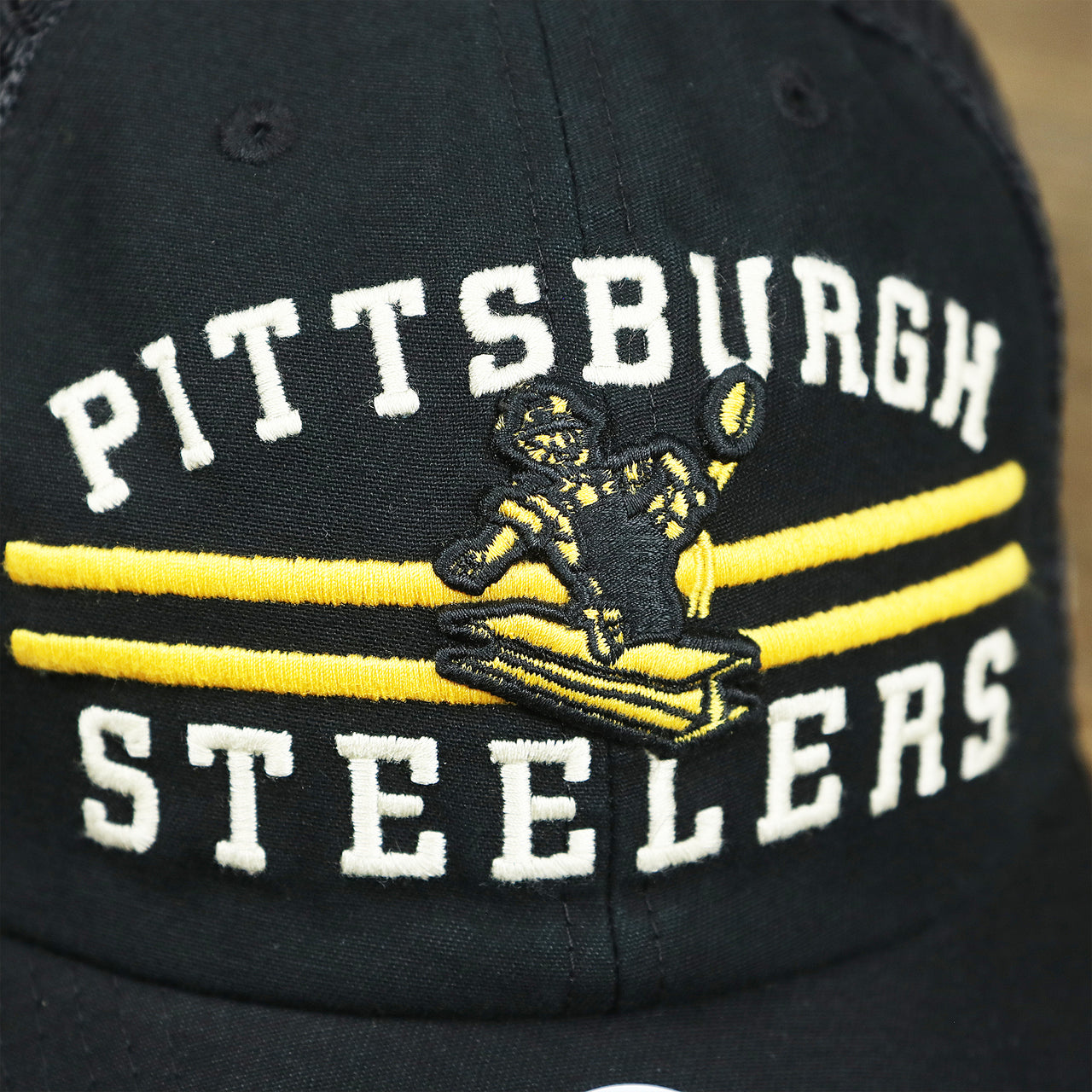 The Steelers Logo and Wordmark on the Throwback Pittsburgh Steelers Legacy Logo Highpoint Mesh Back Dad Hat | Mesh Back Black Dad Hat