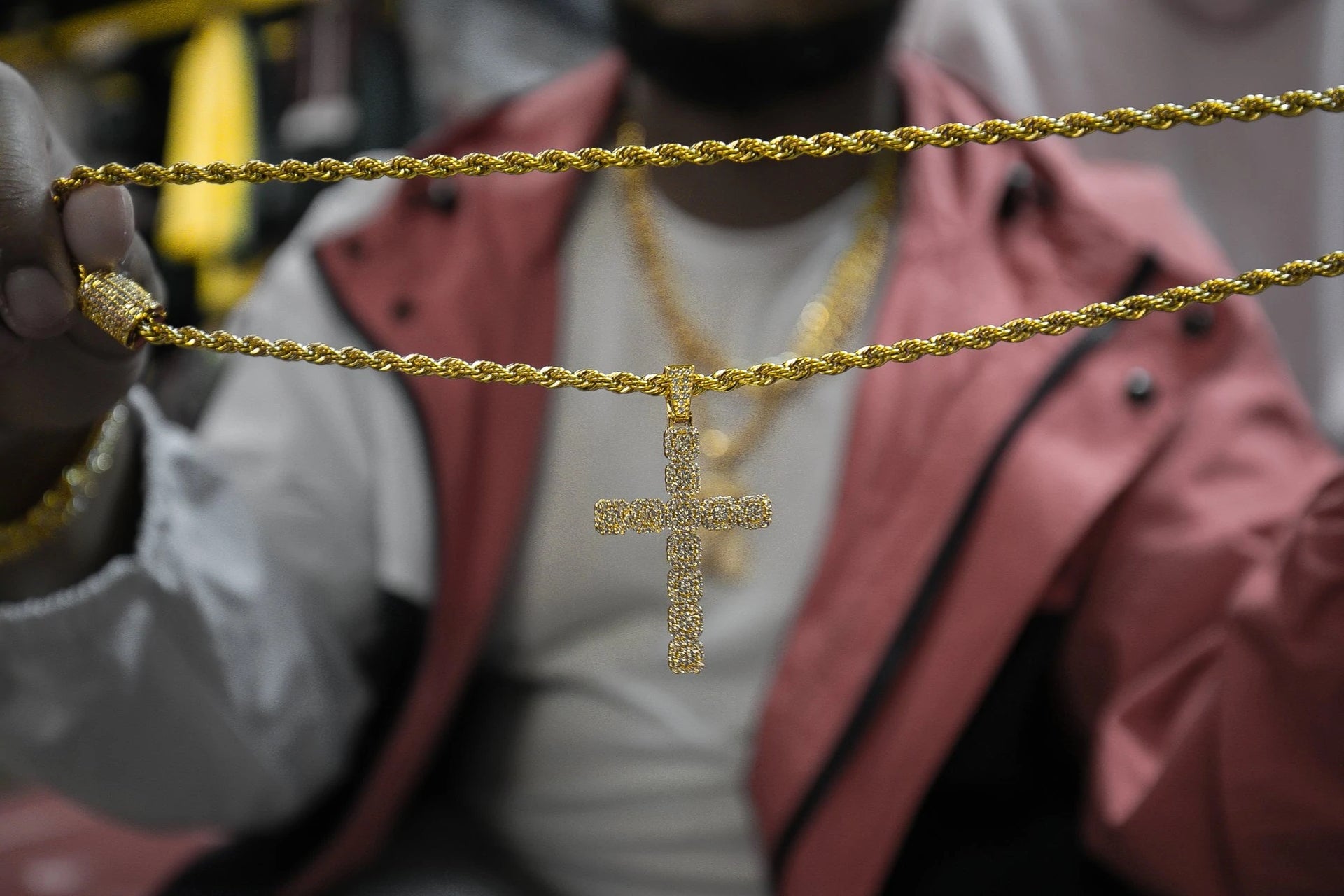 The Iced Out 18K Gold Plated Clustered Cross Pendant | Golden Gilt being stretched