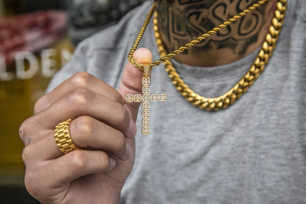 The chain on the Iced Out 18K Gold Plated Clustered Cross Pendant | Golden Gilt being pulled