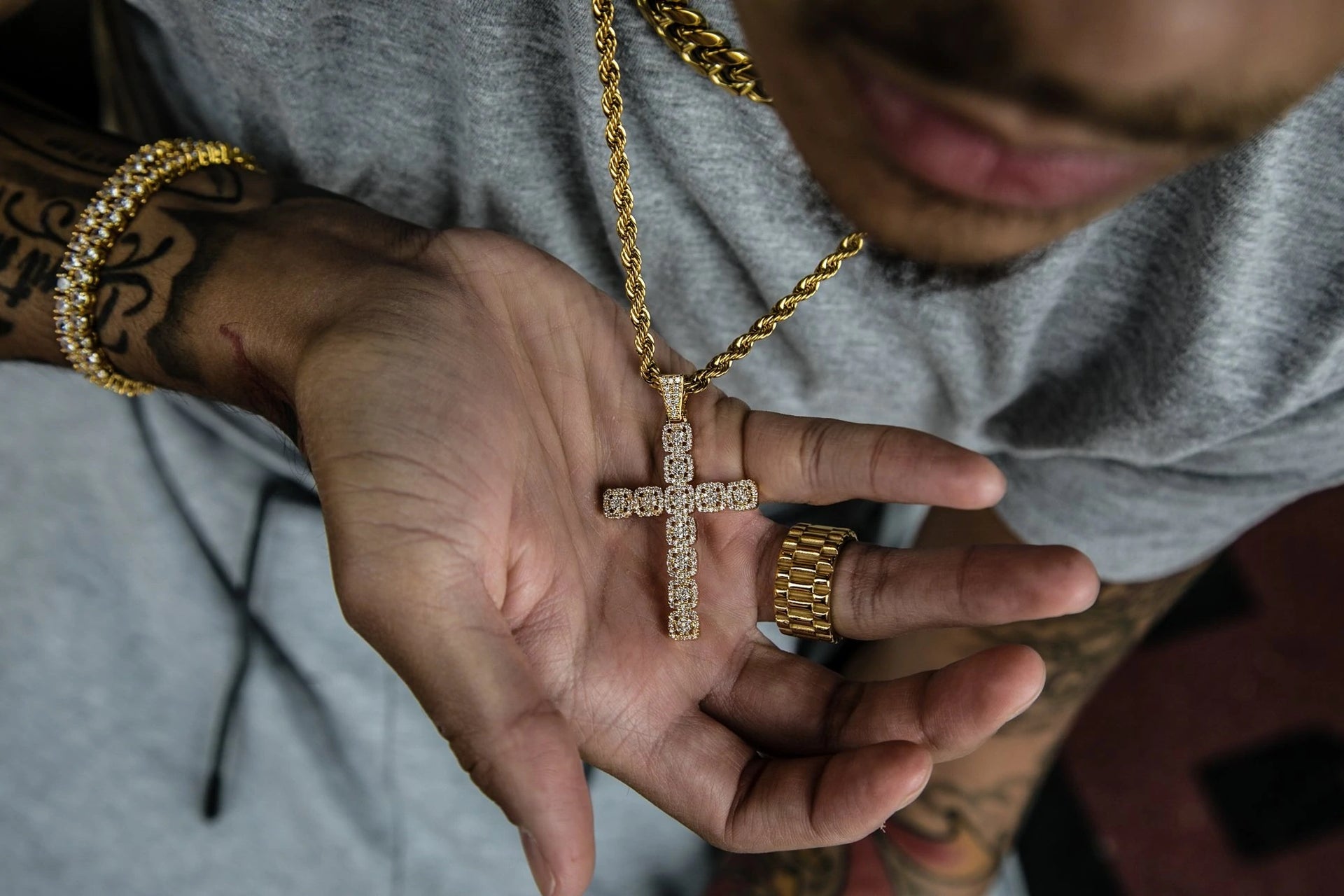 The Iced Out 18K Gold Plated Clustered Cross Pendant | Golden Gilt being worn 