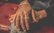 The Iced Out 18K Gold Plated Studded Cuban Link Ring | Golden Gilt on a finger