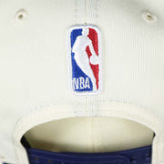 The NBA Jerry West Logo on the back of the Phoenix Suns NBA 2022 Draft Gray Bottom 9Fifty Snapback | New Era Cream/Purple