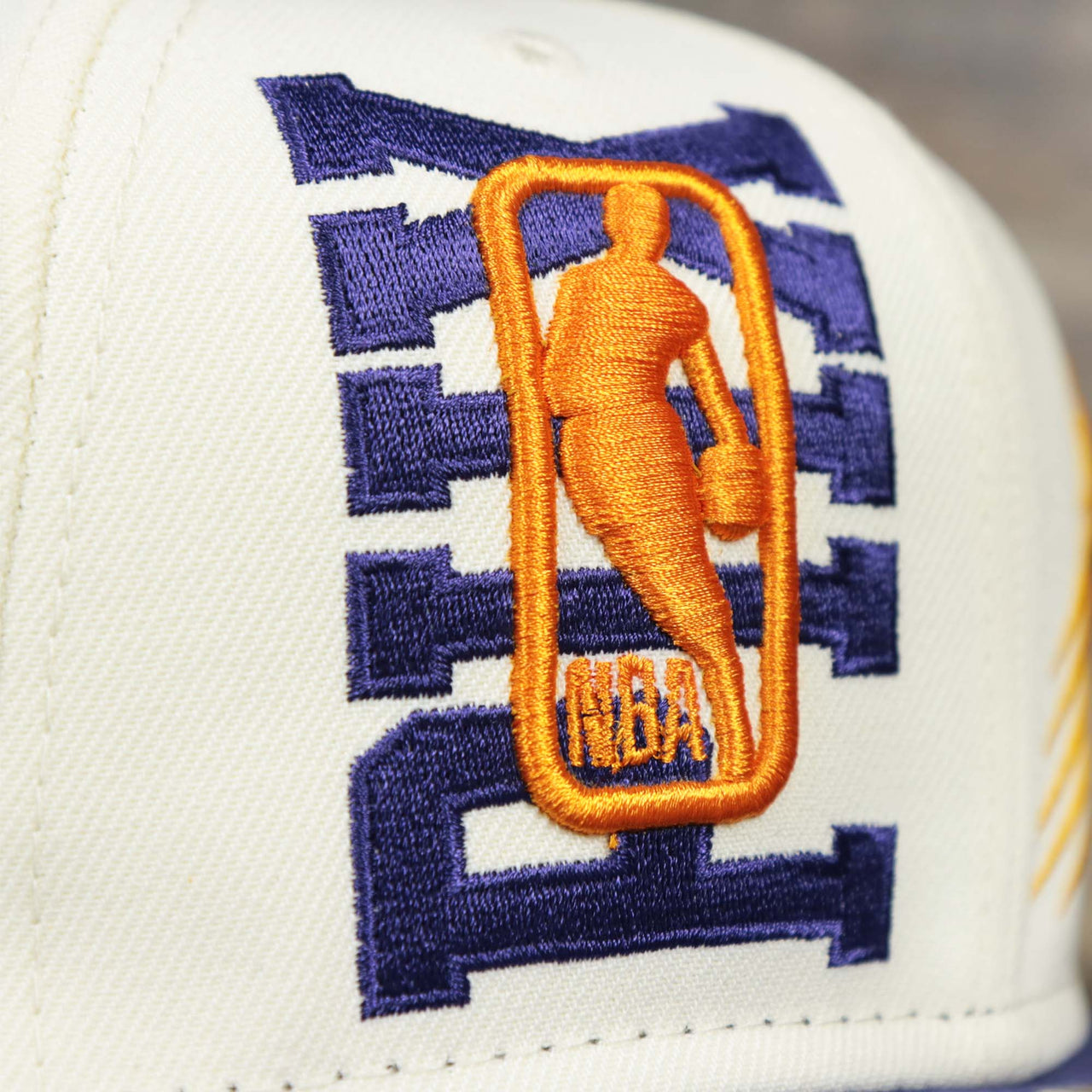 The NBA Jerry West Logo overtop PHILA Phoenix Suns NBA 2022 Draft Gray Bottom 9Fifty Snapback | New Era Cream/Purple