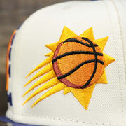 The Logo on the Phoenix Suns NBA 2022 Draft Gray Bottom 9Fifty Snapback | New Era Cream/Purple