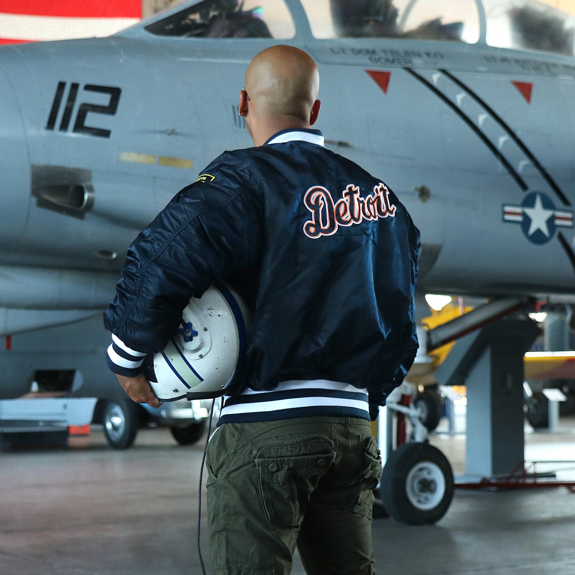 The backside of the Detroit Tigers MLB Patch Alpha Industries Reversible Bomber Jacket With Camo Liner | Navy Blue Bomber Jacket with matching jacket