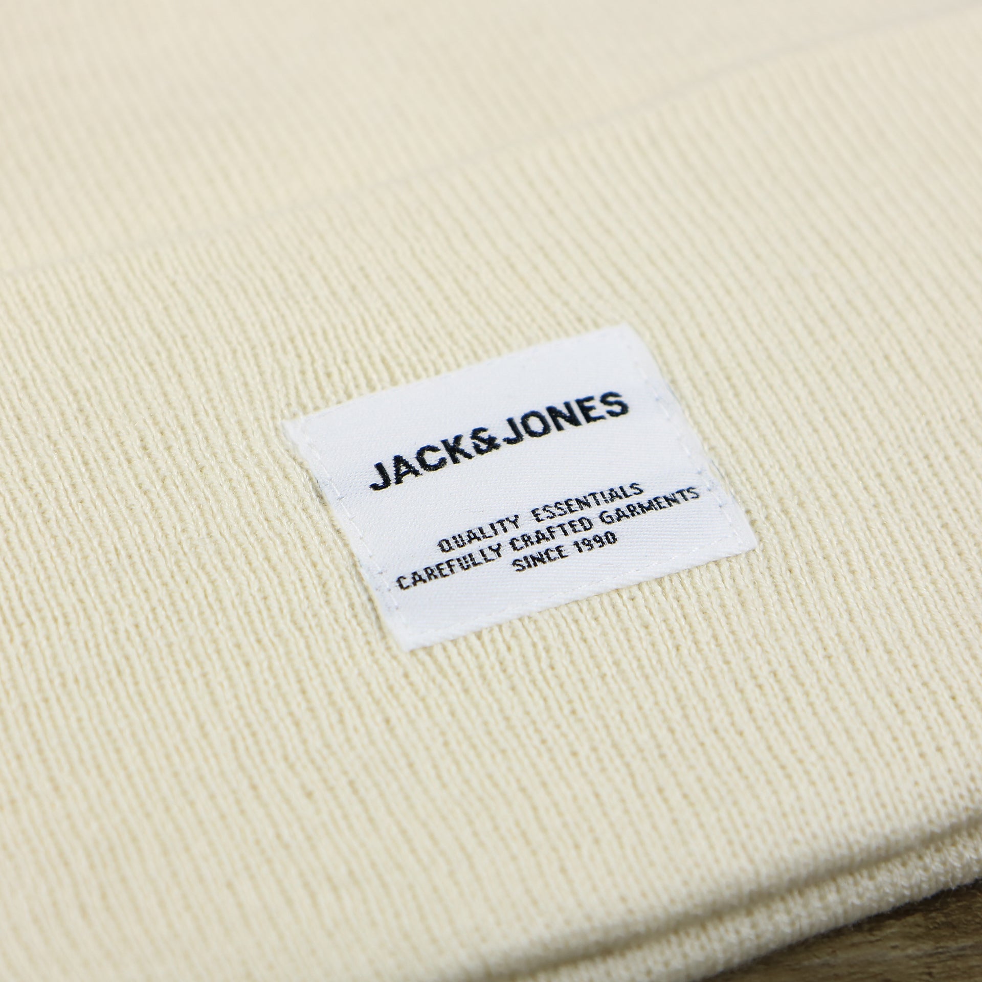 The Jack and Jones Tag on the Jack And Jones Turtle Dove High Cuff Knit Beanie | White Knit Beanie