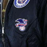 The American League Side Patch on the Detroit Tigers MLB Patch Alpha Industries Reversible Bomber Jacket With Camo Liner | Navy Blue Bomber Jacket