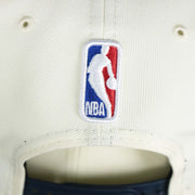The NBA Jerry West Logo on the back of the Minnesota Timberwolves NBA 2022 Draft Gray Bottom 9Fifty Snapback | New Era Cream/Navy Blue