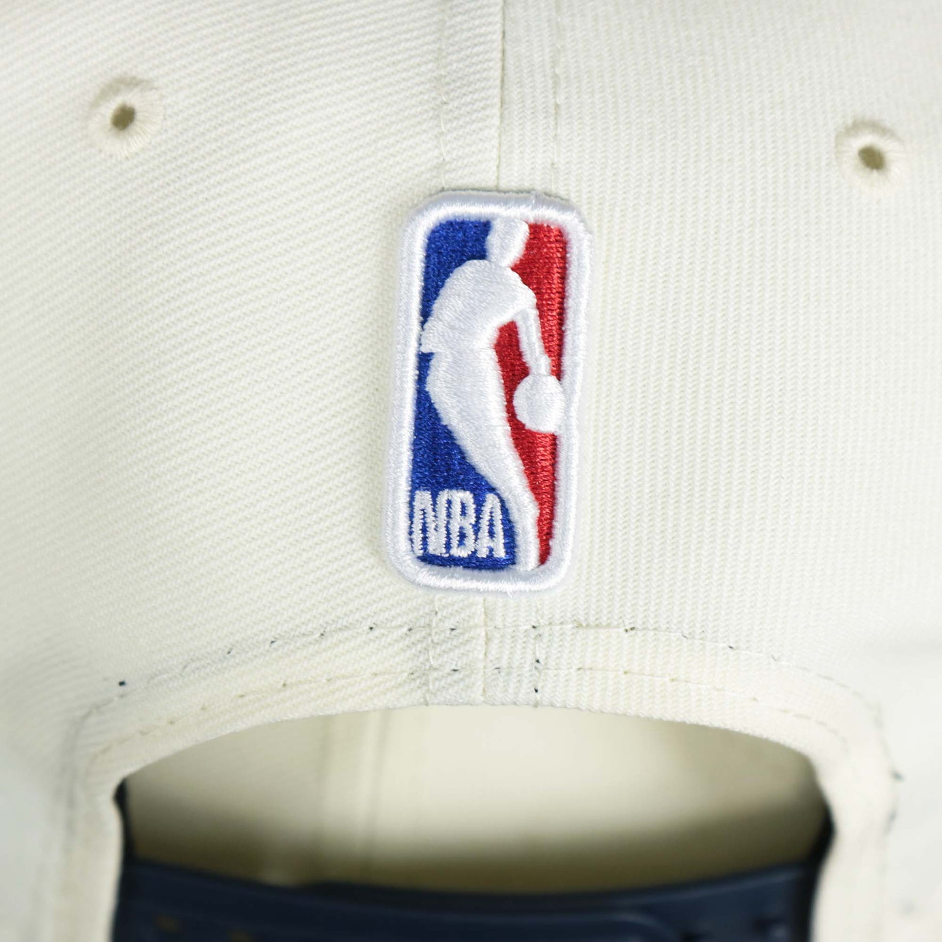 The NBA Jerry West Logo on the back of the Minnesota Timberwolves NBA 2022 Draft Gray Bottom 9Fifty Snapback | New Era Cream/Navy Blue
