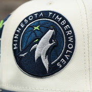 The Logo on the Minnesota Timberwolves NBA 2022 Draft Gray Bottom 9Fifty Snapback | New Era Cream/Navy Blue