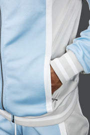 A close up of the zipper pocket on the UNC Basketball Varsity Athletic Track Jacket Jordan Craig