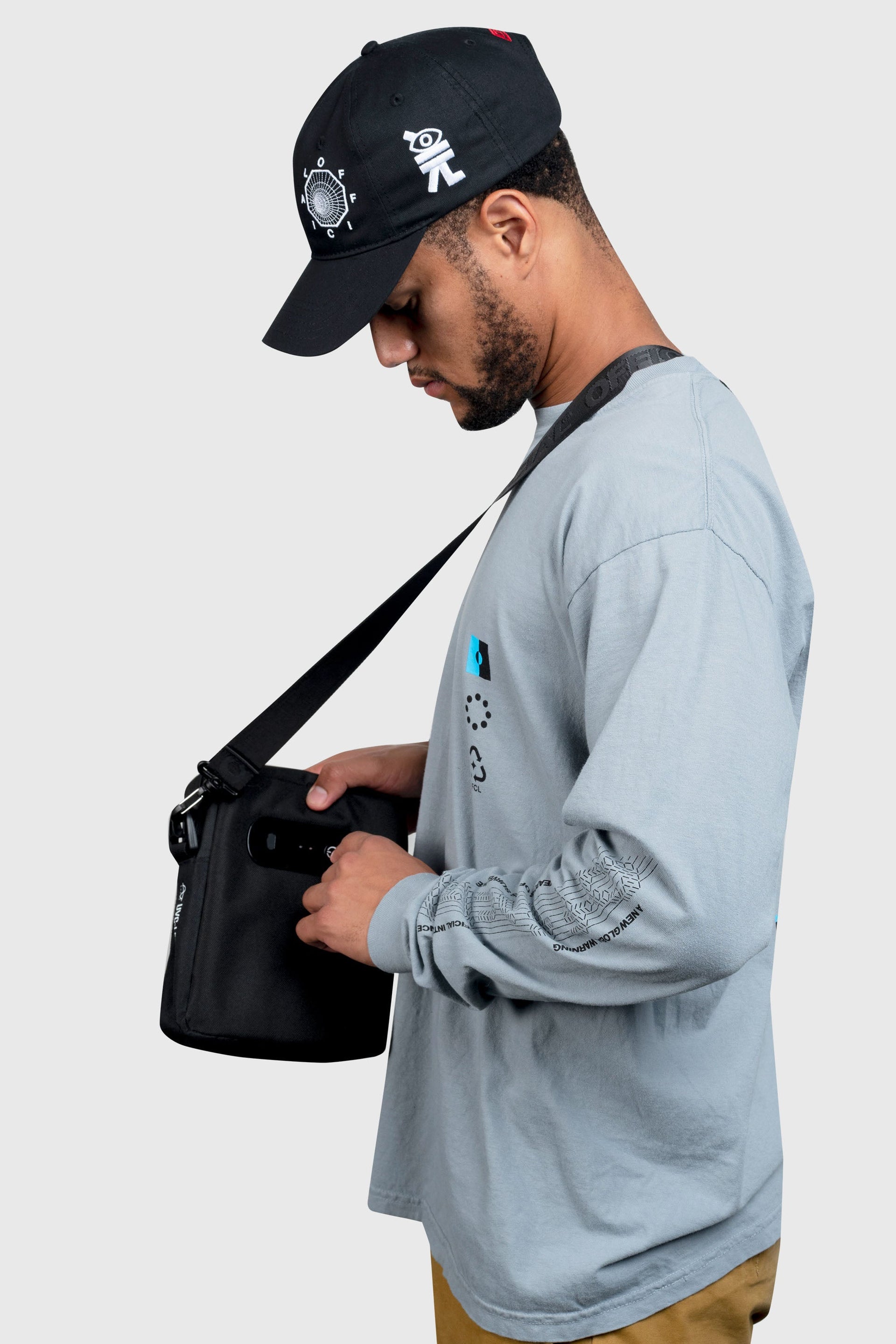 The controls on the UVC Sterilization Shoulder Bag Streetwear | Official Black being used