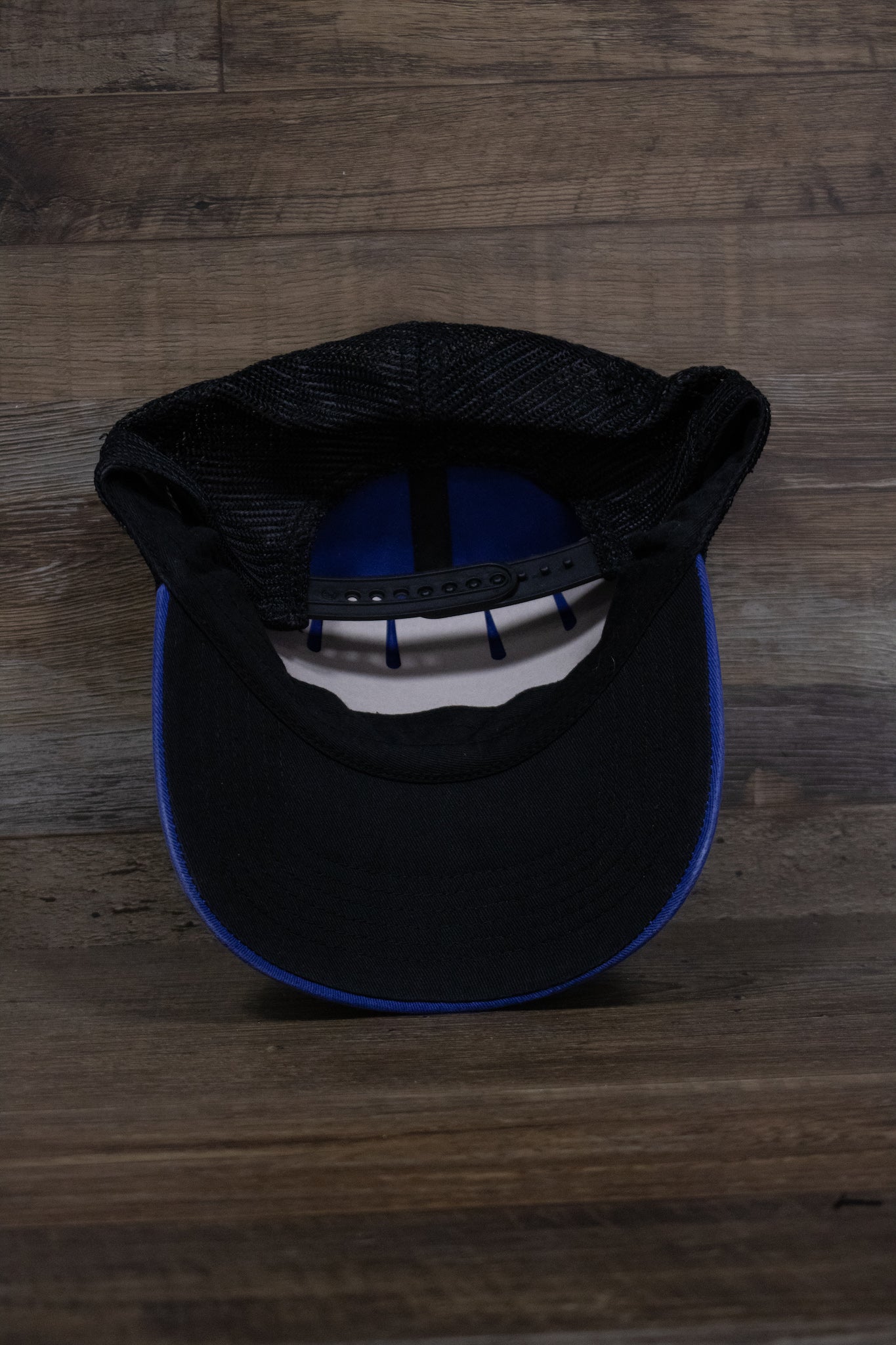 The underside of the Kentucky Wildcats mesh back dad hat shows a black underbrim and the logos for '47 Brand and Official College Products