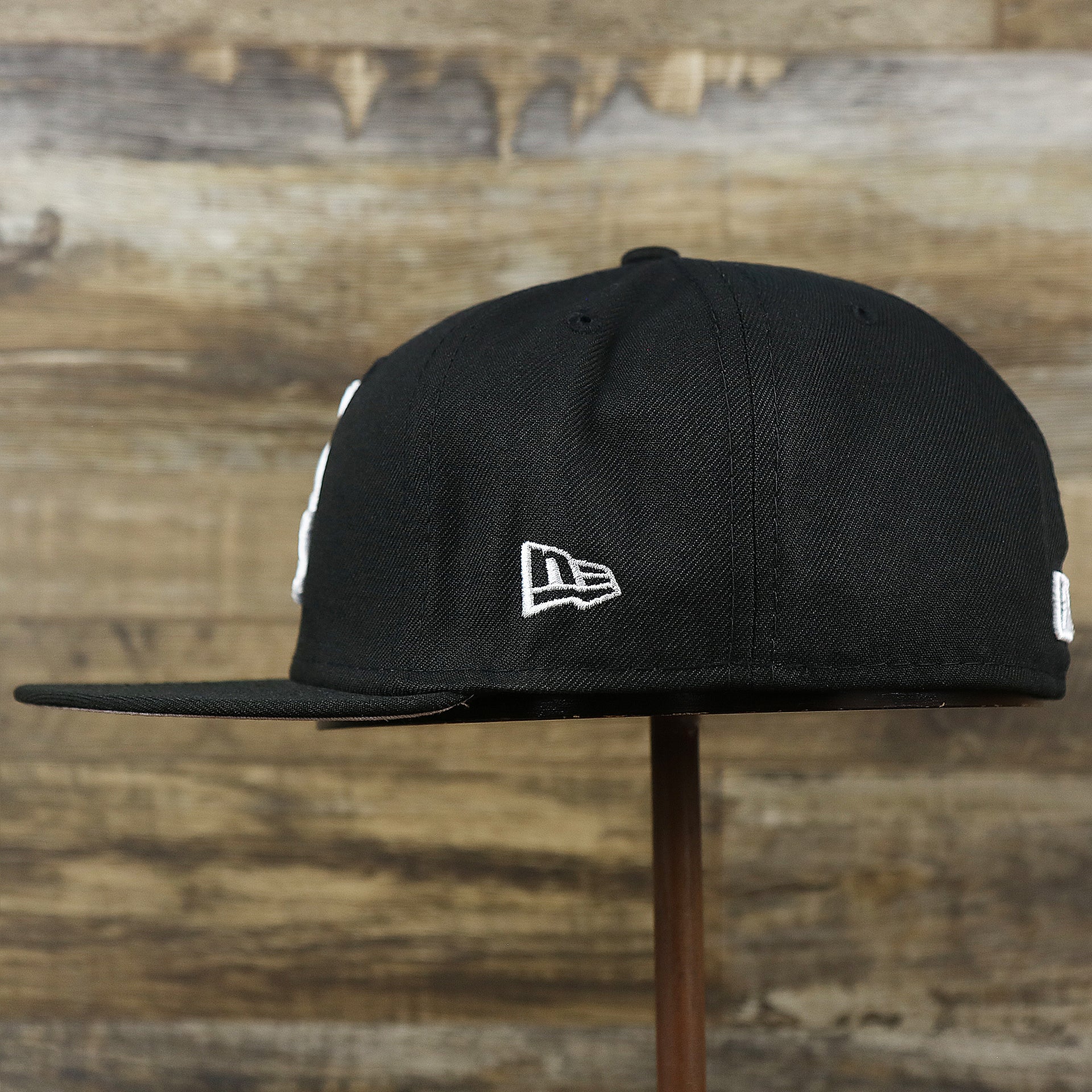 The wearer's left on the Chicago White Sox Southside Side Patch Gray Bottom 59Fifty Fitted Cap | Black 59Fifty Cap