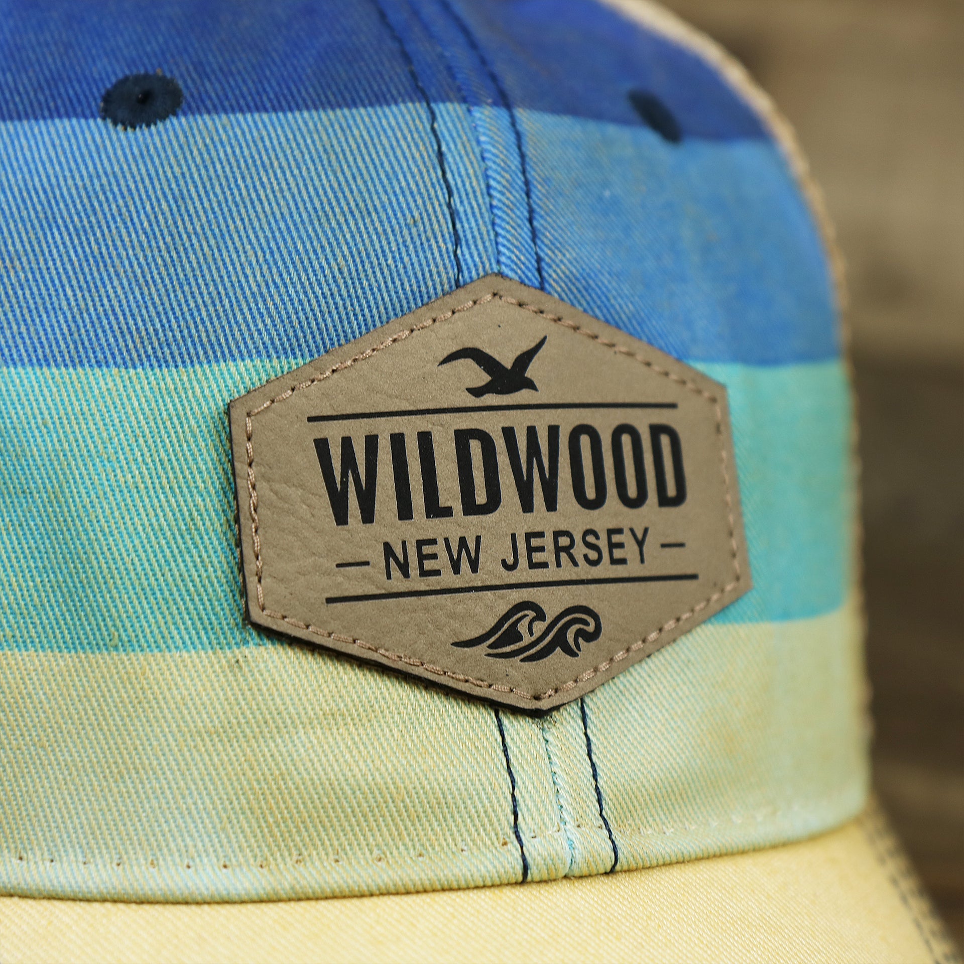 The Wildwood Leather Patch on the Wildwood New Jersey Leather Patch Shoreline Gradient Design Vintage Trucker Hat | Washed Gradient Trucker Hat