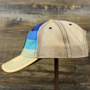 The wearer's left on the Wildwood New Jersey Leather Patch Shoreline Gradient Design Vintage Trucker Hat | Washed Gradient Trucker Hat