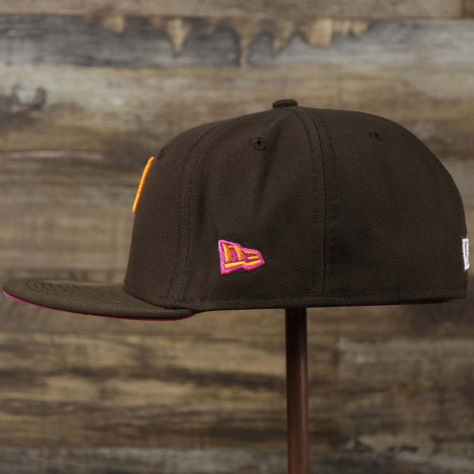 The wearer's left on the Cooperstown Philadelphia Phillies Coffee Shop 1952 All Star Game Liberty Bell Side Patch 59Fifty Fitted Cap | Donut Pack Walnut 59Fifty