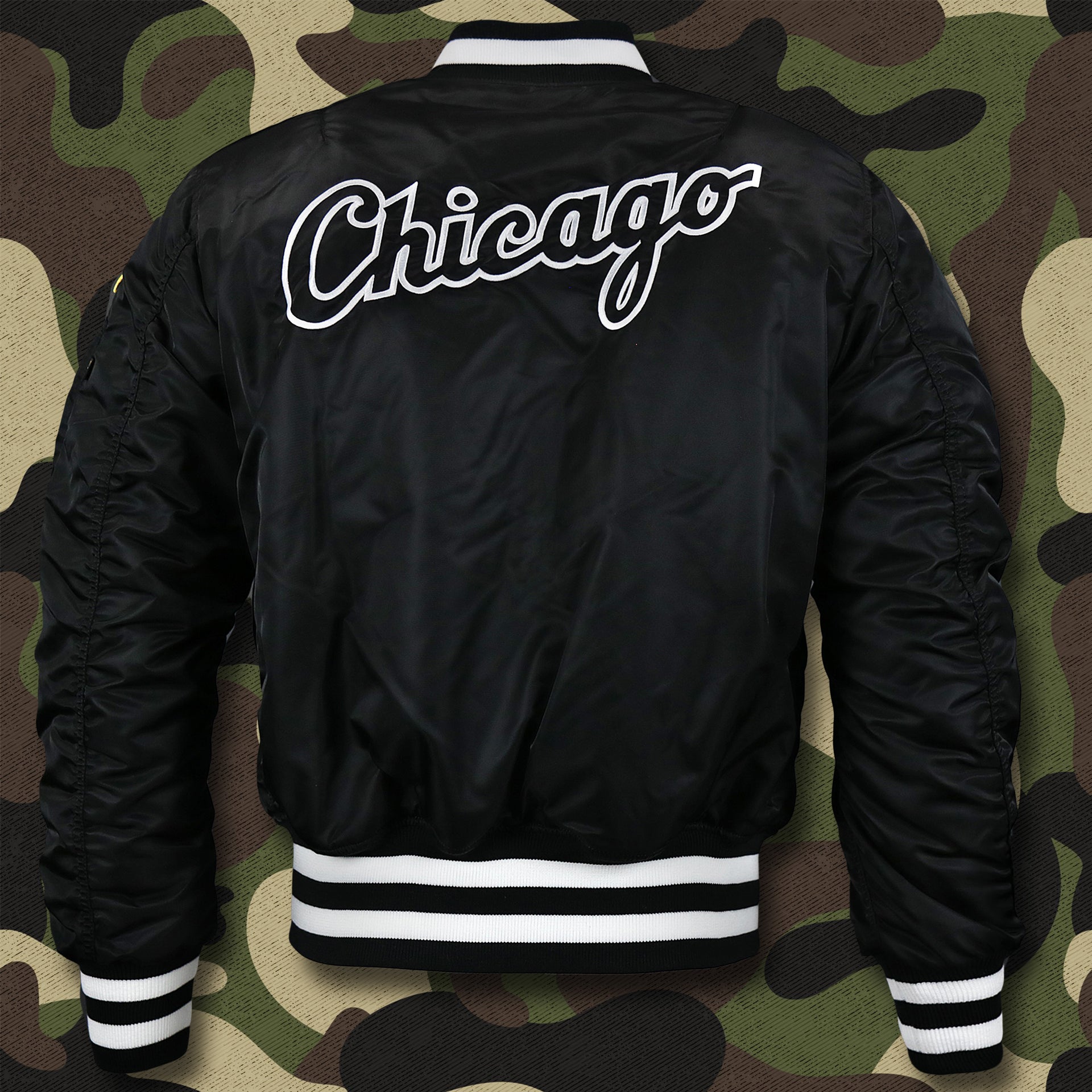 The backside of the Chicago White Sox MLB Patch Alpha Industries Reversible Bomber Jacket With Camo Liner | Black Bomber Jacket